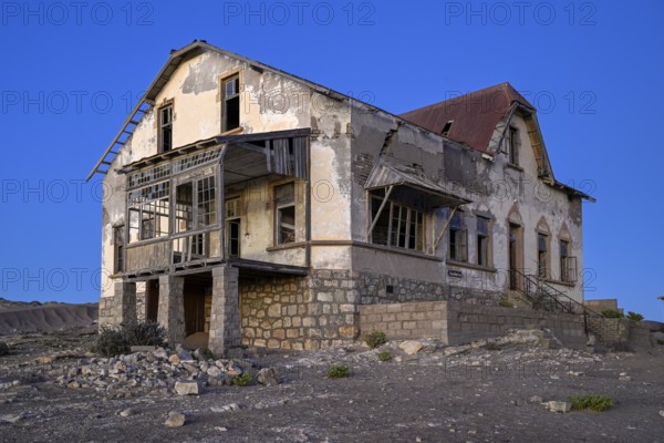 Dilapidated accountant's house in the desert sand, blue hour, Kolmanskop, near Lüderitz, Karas Region, Namibia