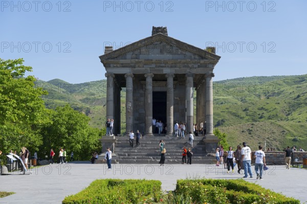 The temple design attracts tourists, surrounded by green, mountainous landscape, Greek-Roman Temple of the Sun, Temple of Garni, Garni, Kotayk Province, Armenia