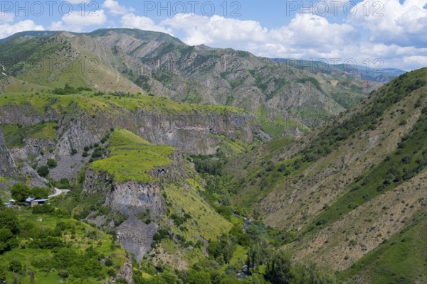 Green mountain landscape with deep gorges under blue sky and clouds, Garni Gorge, Azat River, Kotayk Province, Armenia