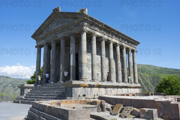 Ancient temple with columns and architectural details against a clear blue sky, Greek-Roman Temple of the Sun, Temple of Garni, Garni, Kotayk Province, Armenia