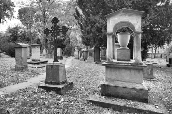 Gravestones, graves, black and white, Hoppenlauf Cemetery, oldest preserved cemetery in Stuttgart, autumn, autumnal, Baden-Württemberg, Germany