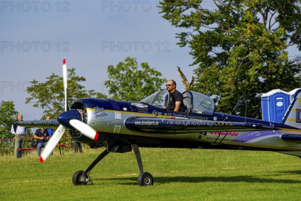 A Jakovlev Jak-55 with the registration LY-AGL during a flight demonstration as part of an air show at the Rossfeld in Metzingen-Glems, Baden-Württemberg, Germany, for editorial use only
