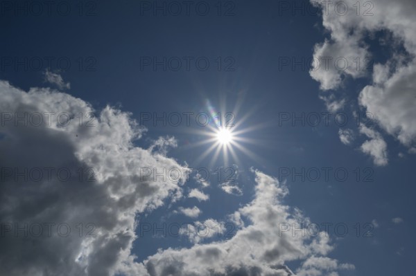 Cloudy sky with sun star, Bavaria, Germany