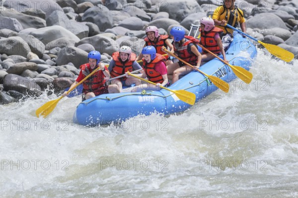 A group of people white water rafting, Costa Rica, Central America