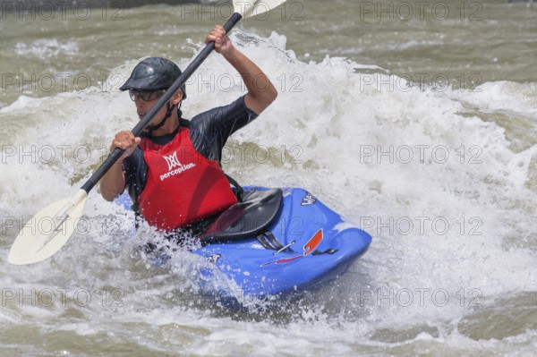Young man kayaking in river, Costa Rica, Central America