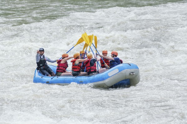 People celebrating white water rafting adventure, Costa Rica, Central America