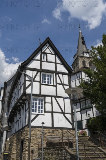 Narrow half-timbered house and church on the market square in the old town, Kettwig, Essen, Rur region, North Rhine-Westphalia, Germany