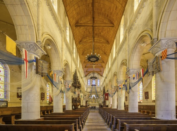 Church of Saint Martin decorated with flags and fishing nets, Yport, Département Seine-Maritime, France