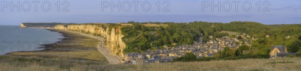View of the village and the chalk cliffs in the evening light, Yport, Département Seine-Maritime, France
