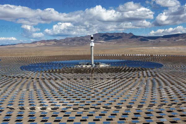 Tonopah, Nevada - The Crescent Dunes Solar Energy Project in the Nevada desert. Ten thousand mirrors reflect sunlight onto a tower where molten salt is heated to produce steam and generate electricity