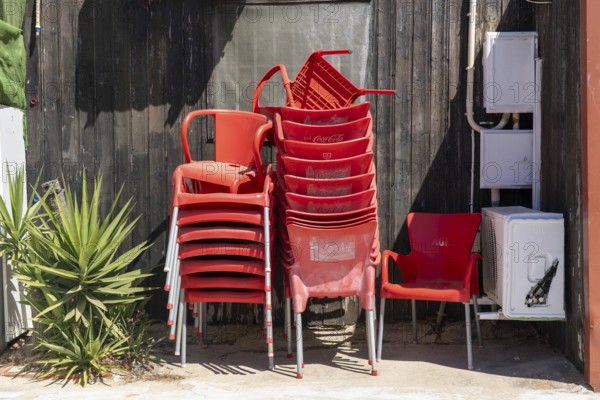 Restaurant furniture, for outdoor catering, tables, chairs, stacked, day off, catering closed, old town of Tavira, Algarve, Portugal