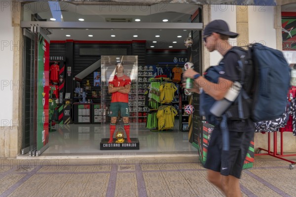 Sports shop, sells merchandise of the Portuguese national football team, various other local football clubs, life-size figure of football star Christiano Ronaldo, CR7, in Vila Real de Santo António, on the border with Spain, Algarve, Portugal