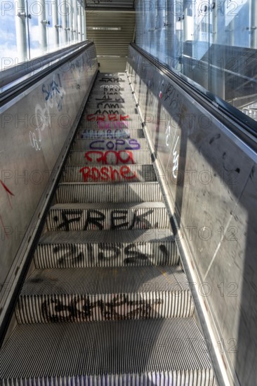 Escalator in a suburban railway station, full of graffiti, Day, Düsseldorf, North Rhine-Westphalia, Germany