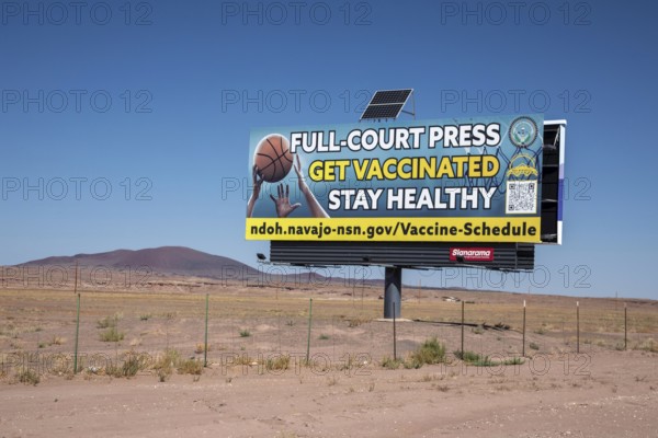 Cameron, Arizona - A billboard advertisement from the Navajo Department of Health urges Navajo citizens to get vaccinated