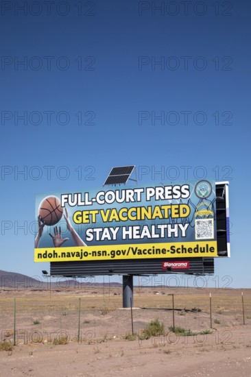 Cameron, Arizona - A billboard advertisement from the Navajo Department of Health urges Navajo citizens to get vaccinated