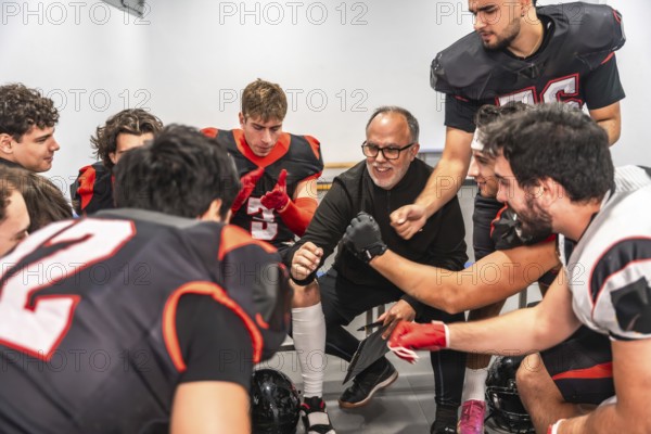 American football coach delivering a motivational speech to a diverse team of young players in their uniforms, huddling together in a locker room, fostering teamwork and strategy