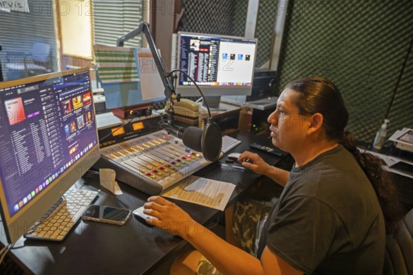 Porcupine, South Dakota - Lucian Little White Man broadcasts on KILI Radio, the voice of the Lakota Nation. The station broadcasts in Lakota and English to the Pine Ridge, Cheyenne River, and Rosebud Indian Reservations. Its finances have been hurt by President Trump's dissolution of the Corporation for Public Broadcasting