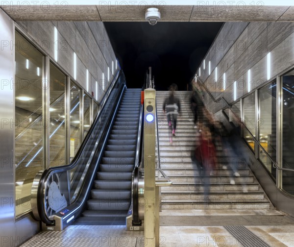 Night photo, long exposure with motion blur, modern underground entrance at Unter den Linden station, contemporary design with stairs and escalator, Berlin, Germany