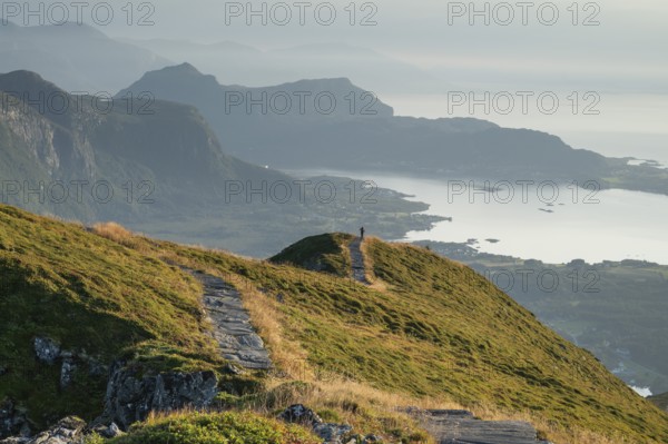 Hikers on Rørsethornet stone staircase, with 3292 steps one of the longest continuous stone staircases in the world, Sherpatreppe or Midsundtreppe or Midsundtrappene, Rørsethornet hike, Otroya or Otrøya island, Møre og Romsdal, Norway