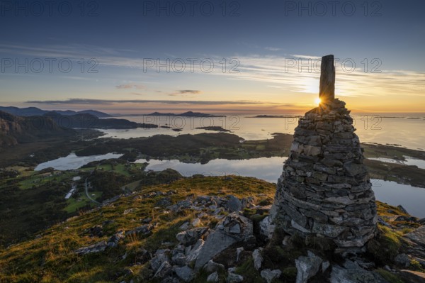 View of the Norwegian coast from the Rørsethornet stone steps, with 3292 steps one of the longest continuous stone steps in the world, Sherpat stairs or Midsund stairs or Midsundtrappene, Rørsethornet hike, cairns, sunset, Otroya or Otrøya island, Møre og Romsdal, Norway