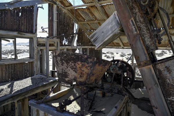 Drum sieve for sieving diamonds in a derelict building, Pomona, restricted diamond area, near Lüderitz, Karas region, Namibia