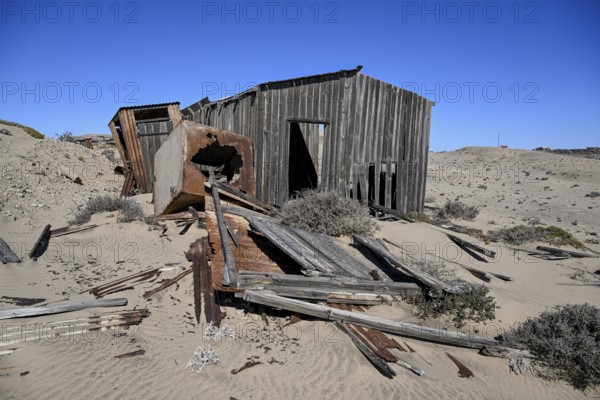 Dilapidated building in the desert sand, Pomona, restricted diamond area, near Lüderitz, Karas region, Namibia