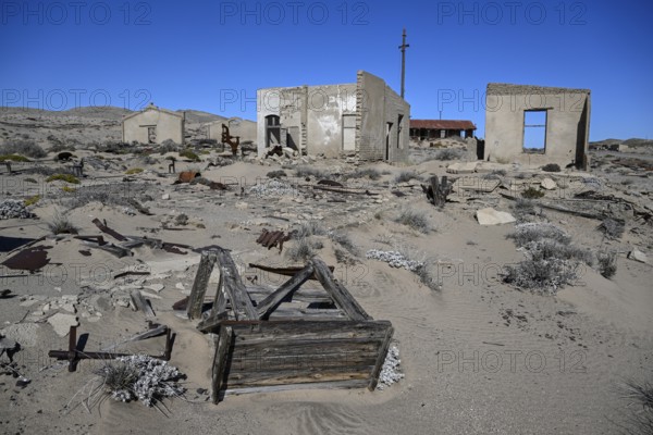 Ruined buildings in the desert sand, Pomona, restricted diamond area, near Lüderitz, Karas region, Namibia