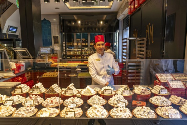 Vendor with large selection of lokum or Turkish honey in Beyoglu, Istanbul, Turkey