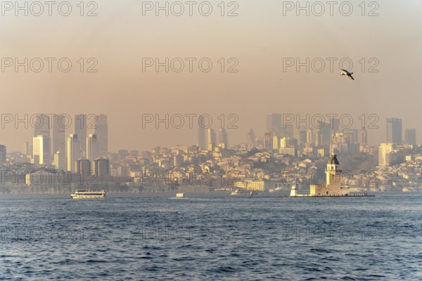 The Maiden Tower lighthouse, Leander Tower or Maiden Tower in front of the skyline of Istanbul, Turkey