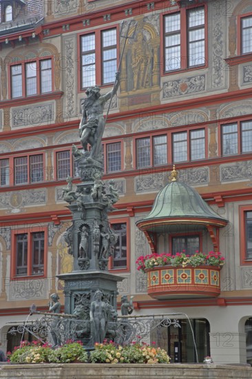 Neptune fountain with sculpture of Neptune Roman god of the sea with trident on the house facade with wall painting and decorations, Renaissance town hall with pulpit, pulpit bonnet, Am Markt, Tübingen, Neckartal, Baden-Württemberg, Germany