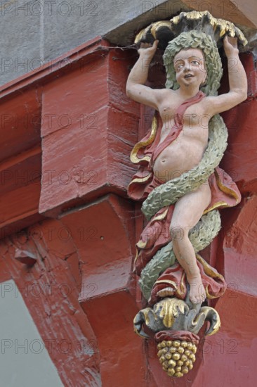 Female naked Bacchante, Roman goddess of wine, Bacchus, mythology, wine culture, wood carving, arts and crafts, sculpture, detail, town hall, Am Markt, Tübingen, Neckar valley, Baden-Württemberg, Germany