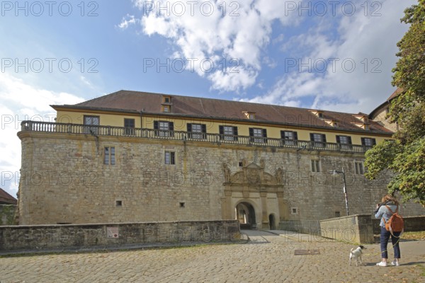 Portal and entrance with tourist taking a photo, castle gate, Hohentübingen Castle, Tübingen, Neckar Valley, Baden-Württemberg, Germany