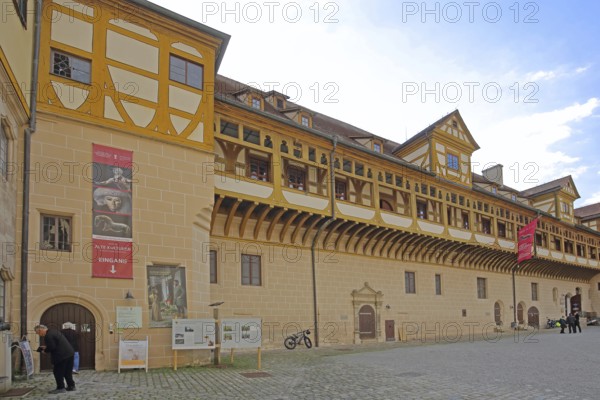 Inner courtyard of Hohentübingen Palace, half-timbered house with arcade, entrance, museum pedestrian, Tübingen, Neckar Valley, Baden-Württemberg, Germany