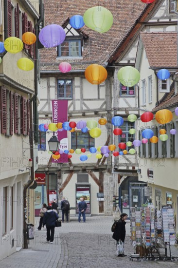 Houses in the Marktgasse with colourful lanterns, decoration, balloons, pedestrians, city museum, shopping, stroll, idyll, Tübingen, Neckartal, Baden-Württemberg, Germany