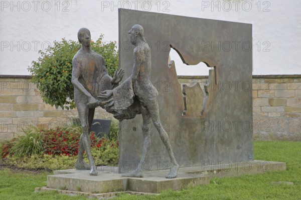 Sculpture Martin of Tours by Karl Ulrich Nuss, Saint Martin sharing his cloak with a beggar, symbol of Christian charity, horse figure, modern art, bronze sculptures, sharing, giving, taking, caring, Caritas, Martinusweg, pilgrimage route, Bischöfliches Ordinariat, Eugen-Bolz-Platz, Rottenburg am Neckar, Neckartal, Baden-Württemberg, Germany