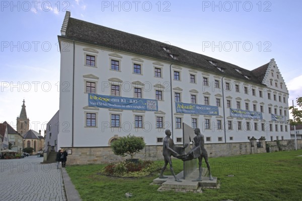 Episcopal Ordinariate built in 1658 with sculpture Martin of Tours by Karl Ulrich Nuss, modern art, horse figure, bronze sculptures, beggar, coat, clothing, Christian, charity, sharing, giving, caring, guarding, protecting, caring, symbol, Martinusweg, pilgrimage route, palace, Eugen-Bolz-Platz, Rottenburg am Neckar, Neckar Valley, Baden-Württemberg, Germany