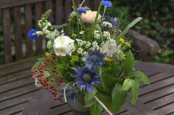 Summer bouquet of flowers on a garden table, Bavaria, Germany