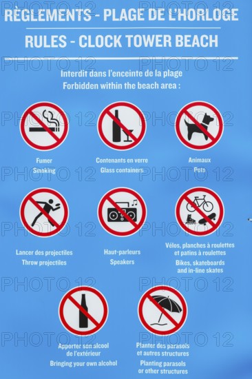 Posted rules sign with pictograms showing various restrictions at Clock Tower Beach, Old Port of Montreal, Quebec, Canada
