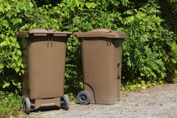 Brown plastic portable composting bins for depositing organic materials and leftover foods in, Quebec, Canada