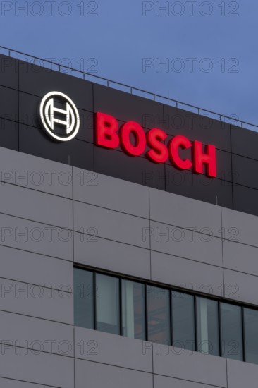 Tall grey building façade with Bosch logo and large windows at night, Waiblingen, Baden-Württemberg, Germany