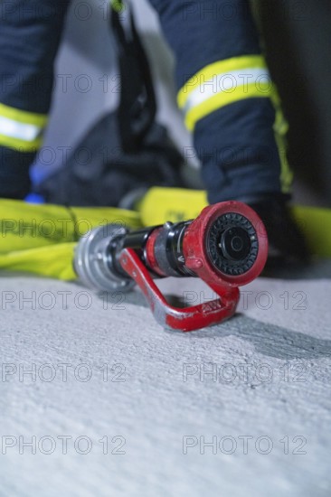 Close-up of a fire hose on the ground, ready for action, fire drill in the new construction tunnel of the Hermann Hesse railway, Ostelsheim, district of Calw, Germany