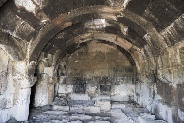 Stone vault with ancient architecture and dark atmosphere, Orbelian's Caravanserai, Selim Caravanserai, located on the Vardenyats Pass or Selim Pass, Vayots Dzor province, Armenia