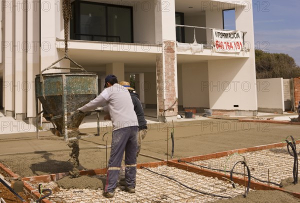 Building construction, construction site, concrete bomb, mortar container, concreting, concreting process, concrete slab, concrete pouring, Playa Arenal, Mediterranean Sea, bay, Calpe Valencia Spain