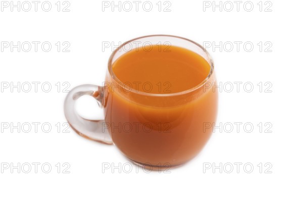 Two glasses with carrot juice isolated on white background. Diet, healthy eating concept. side view, close up, minimalism