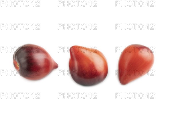 Red Heart shape tomatoes isolated on white background. Side view, copy space, healthy food, vegetable, minimalism