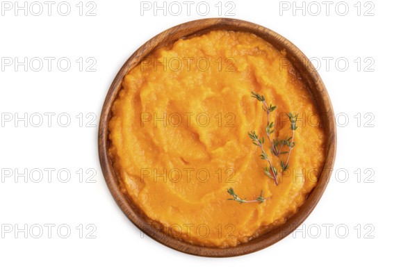 Sweet potato porridge in wooden bowl isolated on white background. Diet, healthy eating concept. top view, flat lay, close up, minimalism