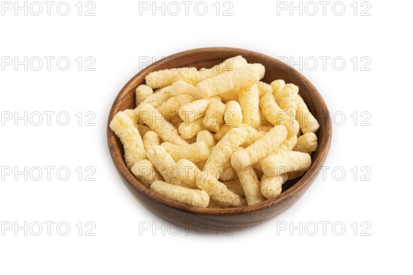Corn flakes sticks with caramel in wooden bowl isolated on white background. side view, close up