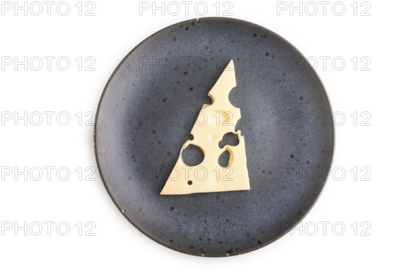 Piece of cheese with holes on blue plate isolated on white background, top view, flat lay, copy space, minimalism