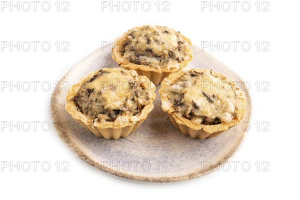 Tartlets with meat and cheese isolated on white background. side view, copy space