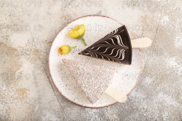 Chocolate and Vanilla Cake pops Marshmallow on brown concrete background. top view, flat lay, copy space